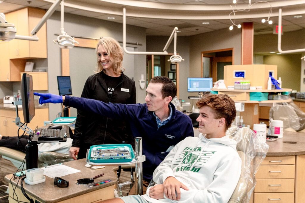 orthodontist fargo&mdash;braces check with assistant at chairside